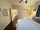Cozy bedroom featuring hardwood floors, a ceiling fan, and a double door closet at 24 Moreland Ne Ave, Atlanta, GA 30307