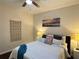Bedroom featuring hardwood floors, a ceiling fan, and a comfortable bed at 24 Moreland Ne Ave, Atlanta, GA 30307