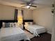 Bedroom with two beds, ceiling fan, and a small nightstand at 24 Moreland Ne Ave, Atlanta, GA 30307