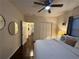 Comfortable bedroom features hardwood floors, a ceiling fan, and ample closet space at 24 Moreland Ne Ave, Atlanta, GA 30307