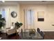 Bright dining area with hardwood floors, lots of natural light, modern furniture, and art at 24 Moreland Ne Ave, Atlanta, GA 30307