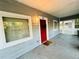 Charming front porch with a vibrant red door and a welcoming wreath decor at 24 Moreland Ne Ave, Atlanta, GA 30307