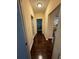 Hallway featuring hardwood floors leading to a bedroom and other rooms at 24 Moreland Ne Ave, Atlanta, GA 30307