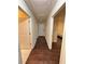 Hallway featuring hardwood floors with views to a bedroom and the front door at 24 Moreland Ne Ave, Atlanta, GA 30307