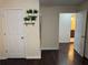 Hallway featuring dark hardwood floors with storage and bathroom access at 24 Moreland Ne Ave, Atlanta, GA 30307