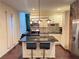 Well-equipped kitchen with a breakfast bar, stainless steel appliances, and ample counter space at 24 Moreland Ne Ave, Atlanta, GA 30307