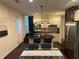 Modern kitchen features stainless steel appliances and an island with a breakfast bar at 24 Moreland Ne Ave, Atlanta, GA 30307