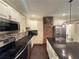 Modern kitchen features stainless steel appliances and an island with a breakfast bar at 24 Moreland Ne Ave, Atlanta, GA 30307