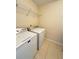Functional laundry room featuring washer, dryer, and convenient overhead storage at 24 Moreland Ne Ave, Atlanta, GA 30307