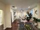 Living room featuring a fireplace, dining area, hardwood floors, ceiling fan and lots of natural light at 24 Moreland Ne Ave, Atlanta, GA 30307
