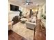 Inviting living area with a fireplace, hardwood floors, large rug, and comfortable furnishings at 24 Moreland Ne Ave, Atlanta, GA 30307