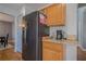 Kitchen with a black refrigerator, wood cabinets, and granite countertops at 351 Grandview Cir, Powder Springs, GA 30127