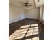 Well lit bedroom with ceiling fan and hardwood floors at 602 Birch River Ln, Lawrenceville, GA 30043