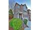 Two-story brick home with a covered front porch and well-maintained landscaping at 602 Birch River Ln, Lawrenceville, GA 30043