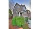 Two-story brick home with a covered front porch and well-maintained landscaping at 602 Birch River Ln, Lawrenceville, GA 30043