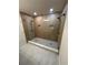 Luxurious shower with dual shower heads, pebble floor, and tiled walls at 602 Birch River Ln, Lawrenceville, GA 30043