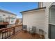 Balcony features two gray chairs, small table, wood decking, and privacy at 2051 Glenview Park Cir, Duluth, GA 30097