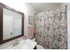 Charming bathroom with a floral shower curtain and a marble vanity at 2051 Glenview Park Cir, Duluth, GA 30097
