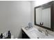 Clean bathroom with modern vanity, white marble countertop, mirror, and fixtures at 2051 Glenview Park Cir, Duluth, GA 30097