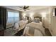 Cozy bedroom featuring two twin beds, a ceiling fan, and hardwood floors at 2051 Glenview Park Cir, Duluth, GA 30097