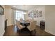 Stylish dining room with elegant furniture, hardwood floors, and abundant natural light at 2051 Glenview Park Cir, Duluth, GA 30097