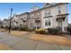 Street view of townhomes, showcasing landscaping, sidewalks, and charming architecture at 2051 Glenview Park Cir, Duluth, GA 30097