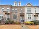 Charming townhome exterior with brick facade, small front yard, and inviting entrance at 2051 Glenview Park Cir, Duluth, GA 30097