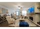 Cozy living room with a stone fireplace, built-in shelving, and lots of natural light at 2051 Glenview Park Cir, Duluth, GA 30097