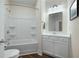 Bathroom featuring a white vanity, tub-shower combo with tiled walls, and modern fixtures at 4901 Pleasantry Nw Way, Acworth, GA 30101