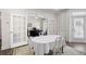 Bright dining room features hardwood floors and glass doors leading to an office and access to a side porch at 4901 Pleasantry Nw Way, Acworth, GA 30101