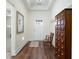 Inviting entryway with wood floors, a decorative cabinet, and a view of the front door at 4901 Pleasantry Nw Way, Acworth, GA 30101