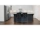 Modern kitchen featuring a kitchen island with barstool seating and stainless steel appliances at 4901 Pleasantry Nw Way, Acworth, GA 30101