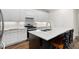 Bright kitchen featuring white cabinets, stainless steel appliances, and an island with a sink at 4901 Pleasantry Nw Way, Acworth, GA 30101