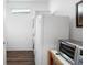 Compact laundry room with a stacked washer and dryer unit, plus a countertop oven at 4901 Pleasantry Nw Way, Acworth, GA 30101