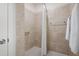 Bathroom shower featuring neutral-colored tiles, modern fixtures, and a shower curtain for privacy at 4901 Pleasantry Nw Way, Acworth, GA 30101