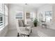 Cozy sitting area with natural light, shutters, and neutral carpeting at 4901 Pleasantry Nw Way, Acworth, GA 30101