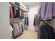 Walk-in closet featuring multiple rows of hanging clothes and shelving at 4901 Pleasantry Nw Way, Acworth, GA 30101