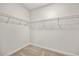 Empty walk-in closet featuring metal shelving, carpet floors and white walls at 1019 Cooks Farm Way, Woodstock, GA 30189