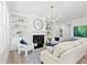 Bright and modern living room with built in bookshelves and a stylish fireplace at 1019 Cooks Farm Way, Woodstock, GA 30189