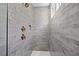 Sleek shower with gray subway tile, gold fixtures, and a built-in niche at 1019 Cooks Farm Way, Woodstock, GA 30189