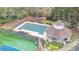 Aerial view of the community pool, tennis courts, and playground surrounded by lush trees and greenery at 4051 Ridgehurst Se Dr, Smyrna, GA 30080