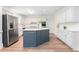 Spacious kitchen featuring a center island with blue cabinets, white countertops, and stainless appliances at 4051 Ridgehurst Se Dr, Smyrna, GA 30080