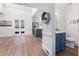 Spacious open floor plan with a kitchen featuring an island with blue cabinets and stainless appliances at 4051 Ridgehurst Se Dr, Smyrna, GA 30080