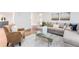 Cozy living room showcasing a fireplace, and sectional sofa, and a glass coffee table on a patterned rug at 4051 Ridgehurst Se Dr, Smyrna, GA 30080