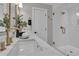 Bright bathroom featuring double vanity, quartz countertop, gold fixtures, and glass-enclosed shower at 459 Lester Rd, Fayetteville, GA 30215