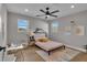 Comfortable bedroom with light gray walls, hardwood floors, and a ceiling fan at 459 Lester Rd, Fayetteville, GA 30215