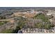 Aerial view of cozy homes with a wooded area in the background at 102 Crescent Woode Way, Dallas, GA 30157