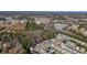 An aerial view of homes in a neighborhood with a wooded backdrop at 102 Crescent Woode Way, Dallas, GA 30157