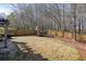 Spacious fenced backyard with wooden playset, perfect for outdoor activities and Gathering fun at 102 Crescent Woode Way, Dallas, GA 30157