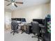 Spacious room with multiple monitors, multiple chairs, and ample desk space for productivity at 102 Crescent Woode Way, Dallas, GA 30157